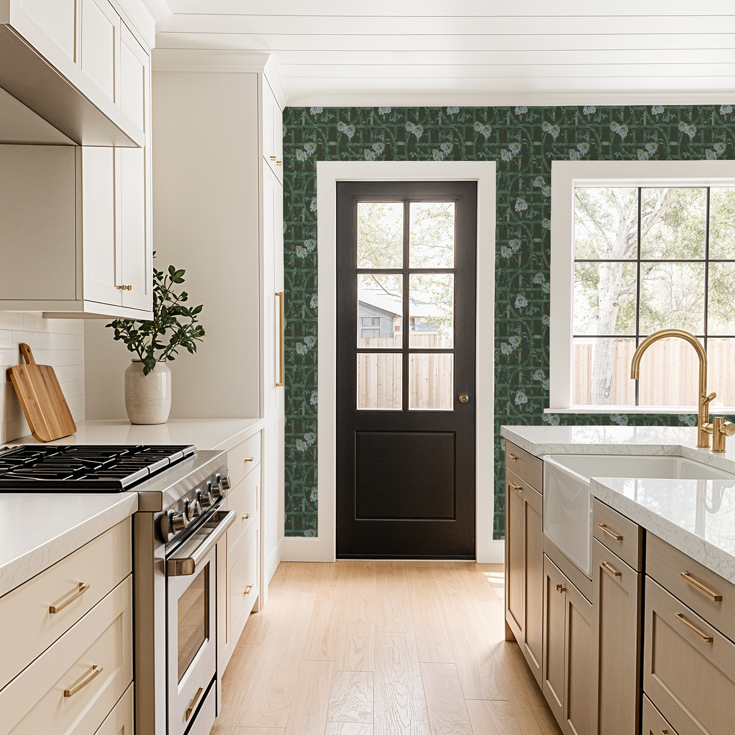 Green trellis and hydrangea wallpaper in a modern kitchen setting.