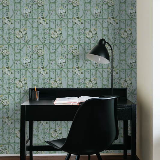 Green trellis wallpaper with hydrangeas in a modern study room setting.