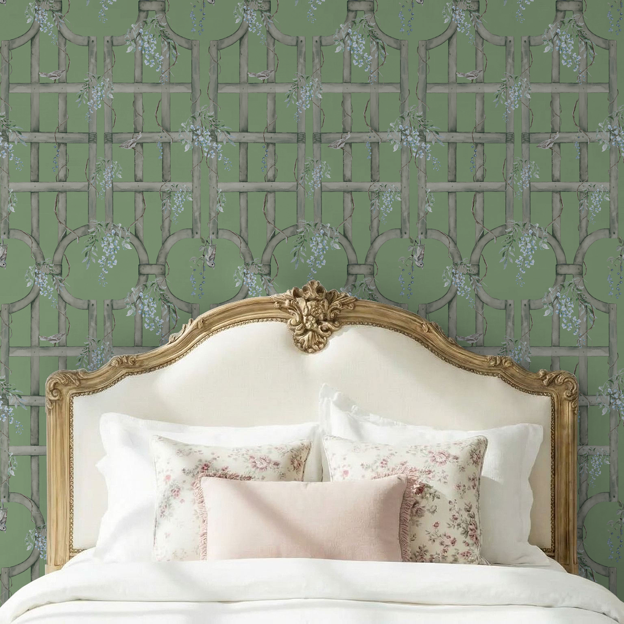 Green trellis wallpaper with birds and vines in vintage bedroom setting.