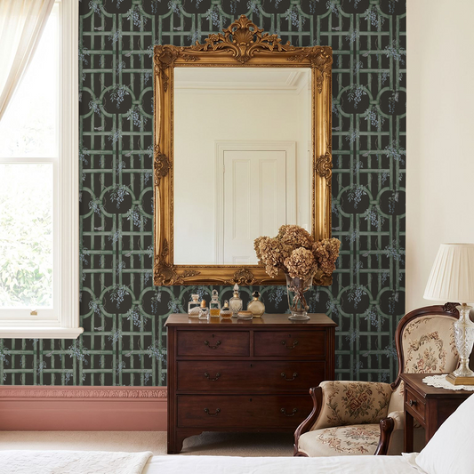 Elegant bedroom with green trellis wallpaper and vintage decor.