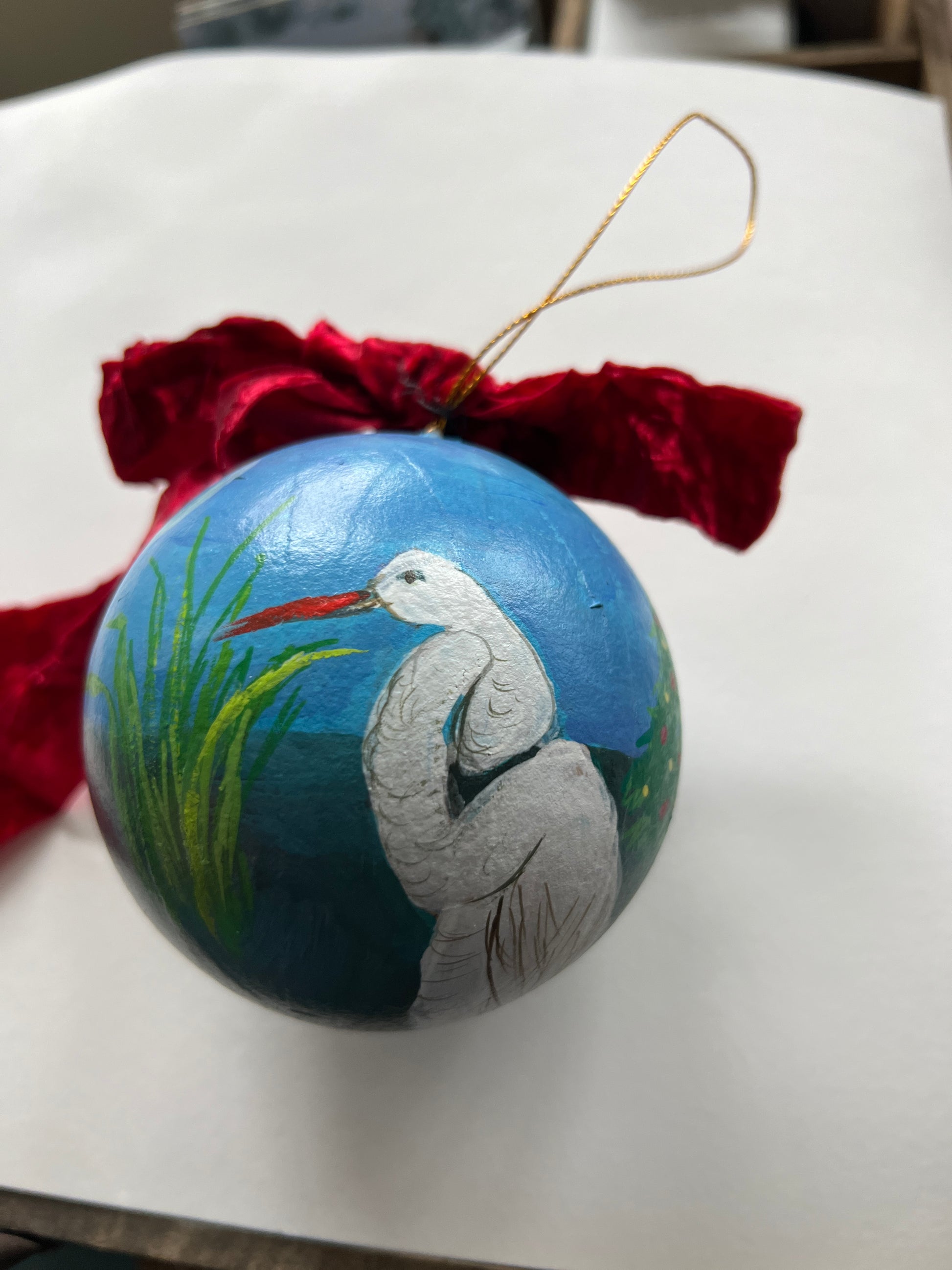 Decorative ornament with a bird design on a white surface