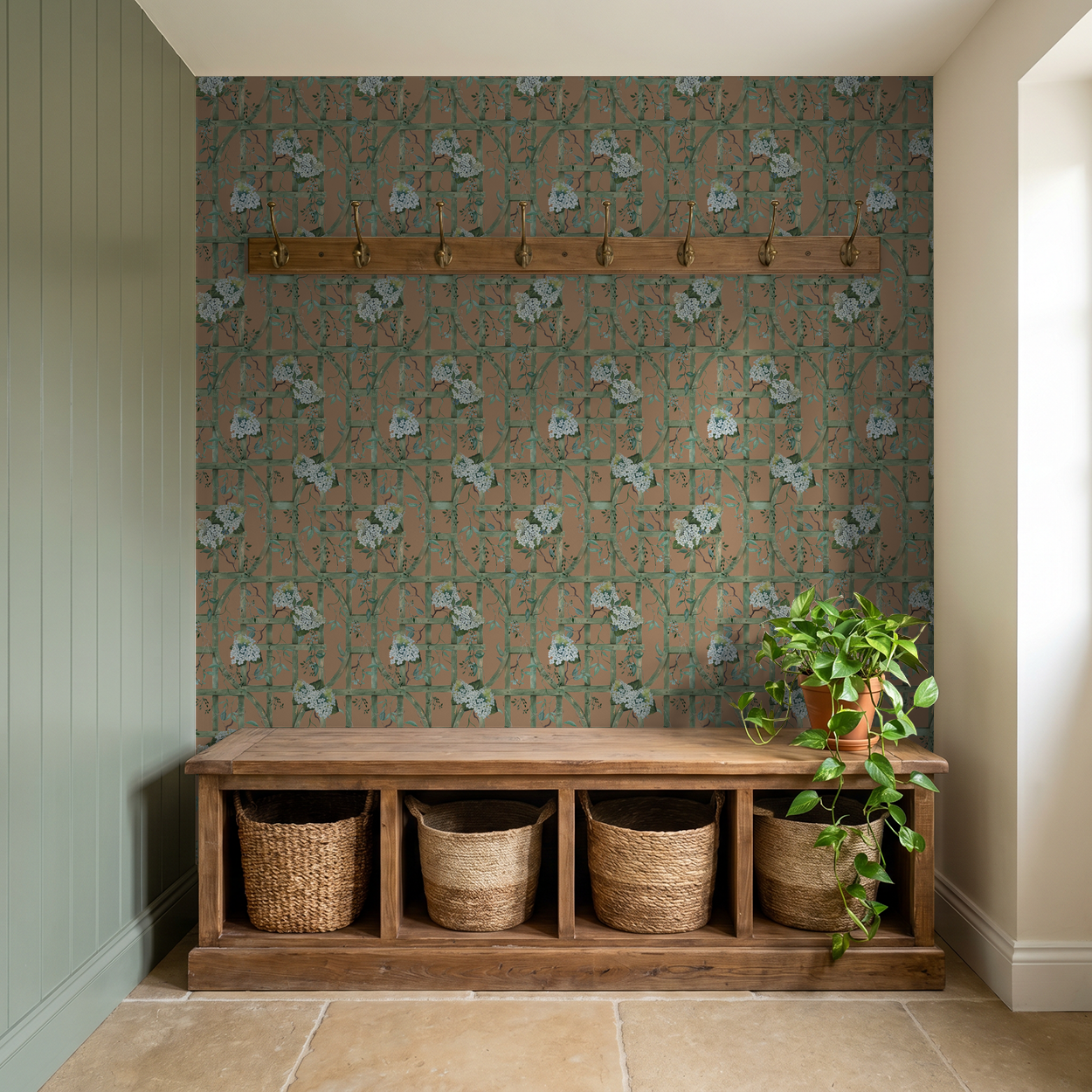 Hydrangea Row Green Trellis wallpaper in rustic entryway with wooden bench and baskets.
