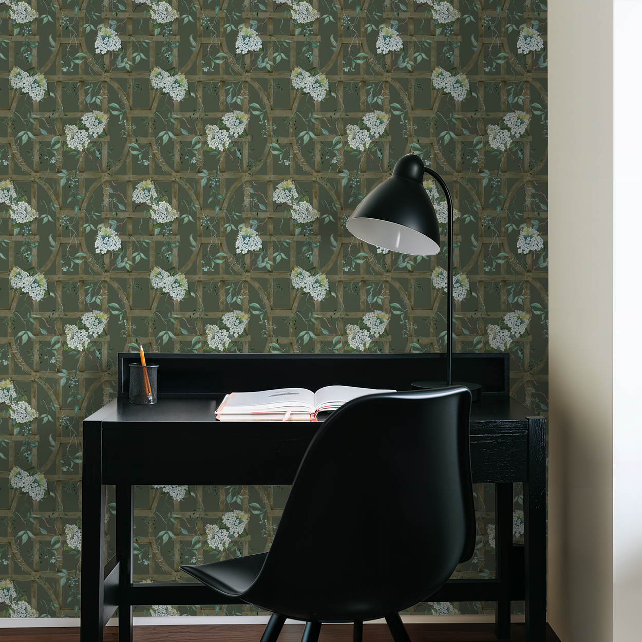 Hydrangea trellis wallpaper in a study room with desk and lamp.