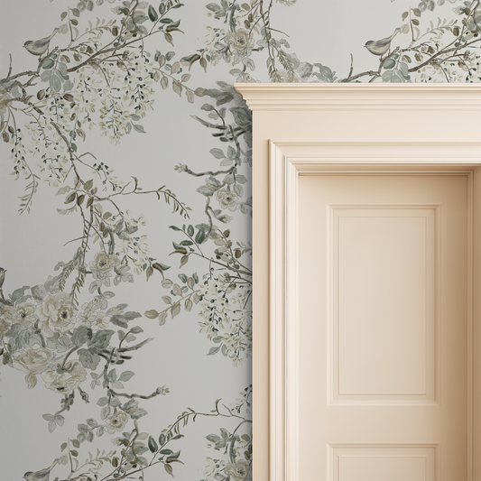 Ivory floral and bird wallpaper with branches beside a cream door frame.