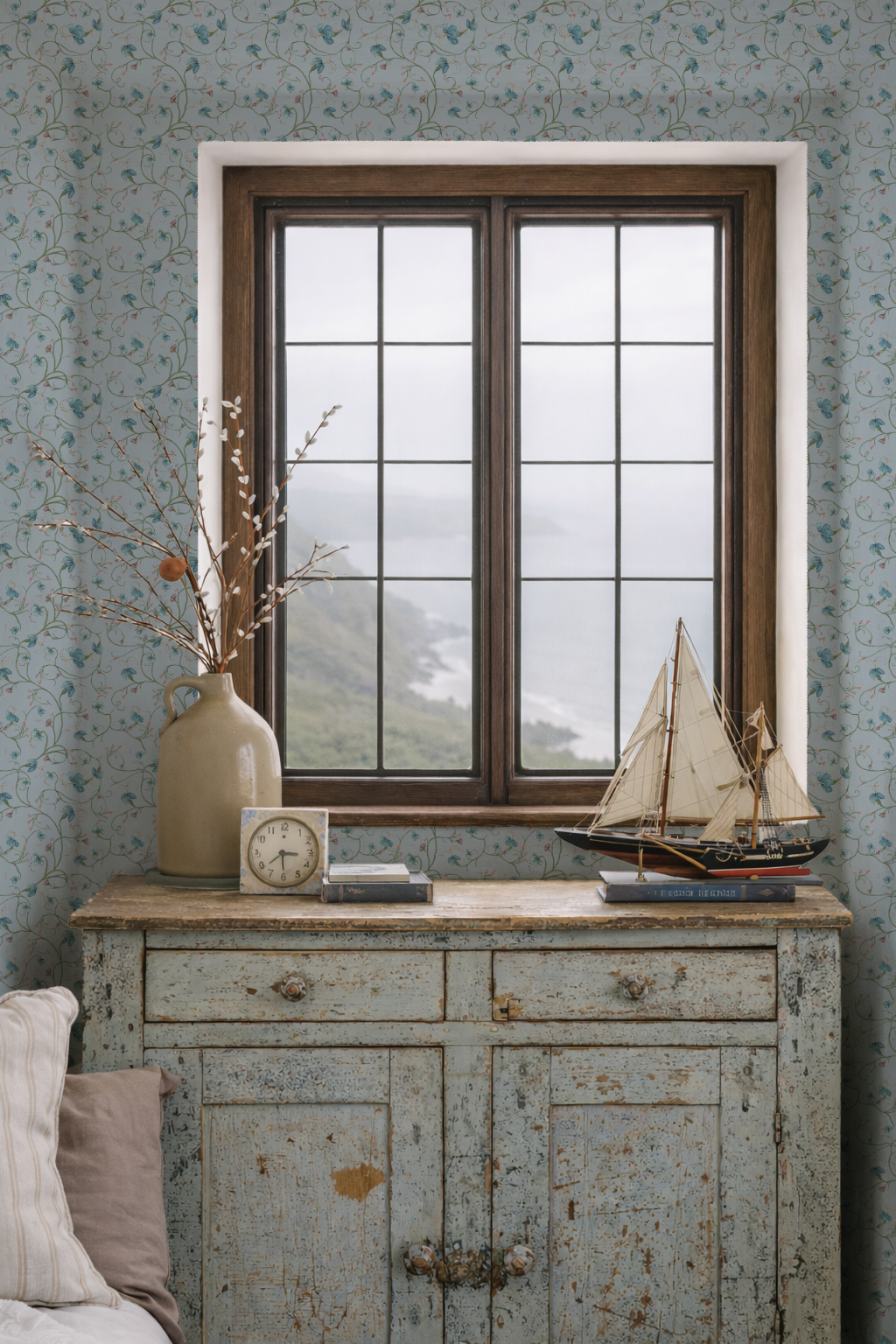 Vintage-style room with a wooden sideboard, window, and decorative items.