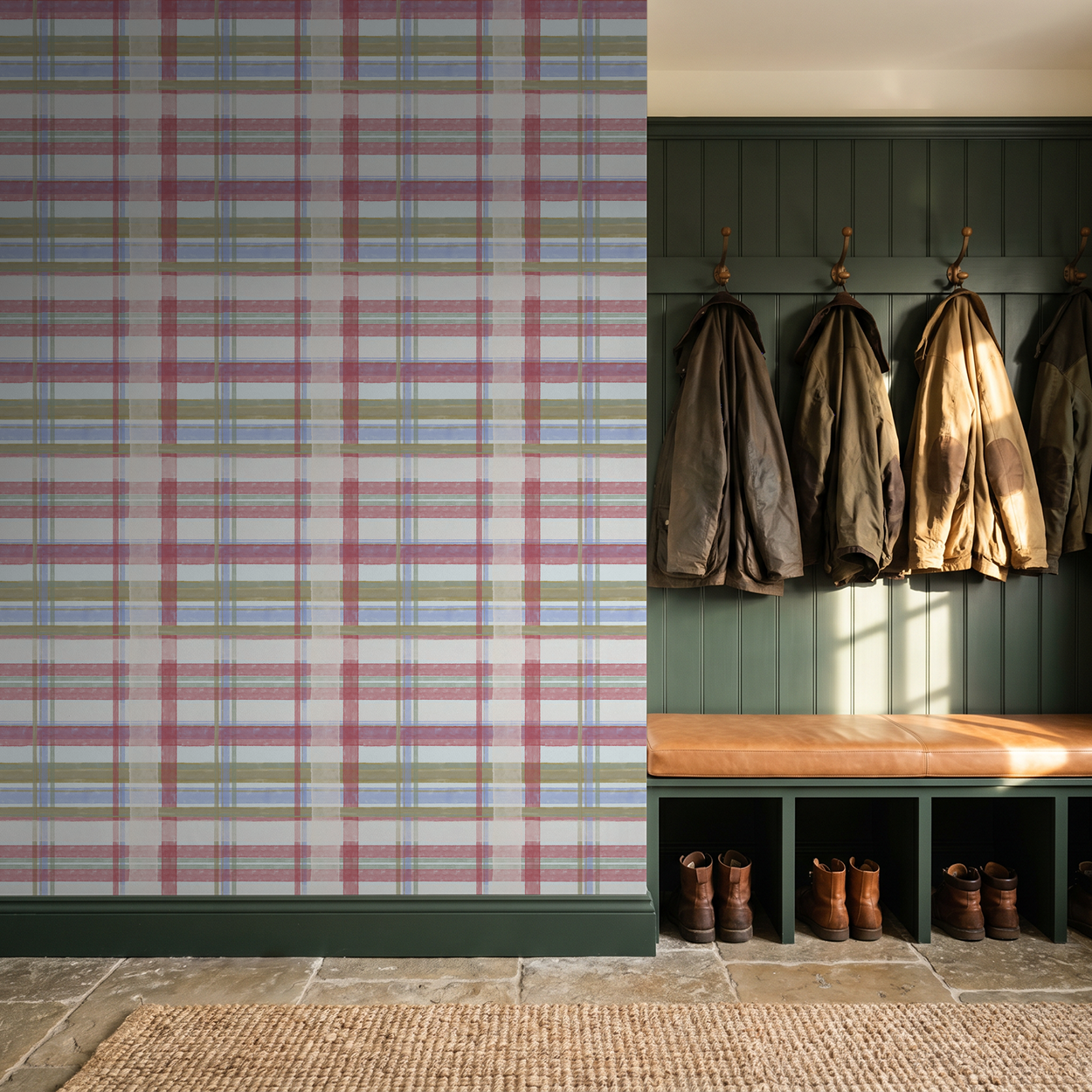 Light blue plaid wallpaper in rustic entryway with coats and boots.