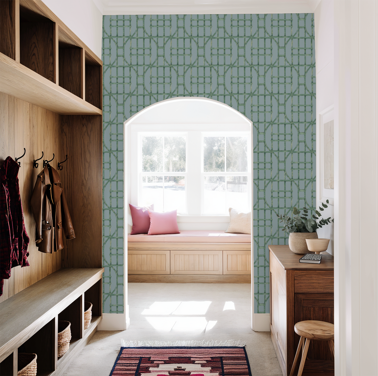 Mint green trellis pattern on soft blue wallpaper in a cozy entryway with wooden accents.