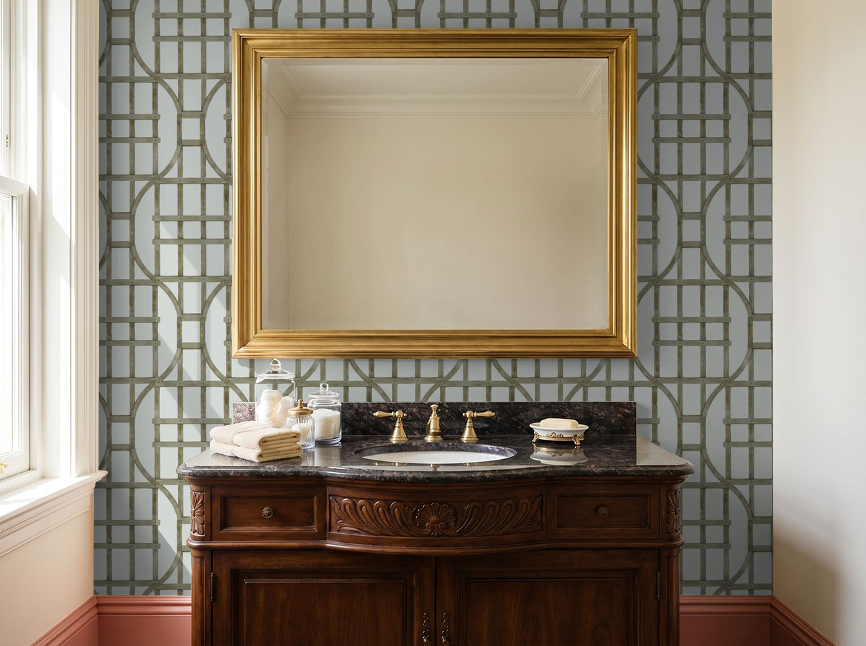 Elegant bathroom with muted green trellis wallpaper and wooden vanity