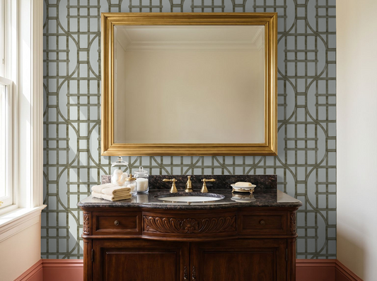 Elegant bathroom with muted green trellis wallpaper and wooden vanity