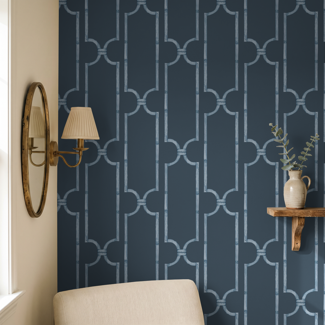 Navy geometric trellis wallpaper in elegant room with mirror and shelf decor.