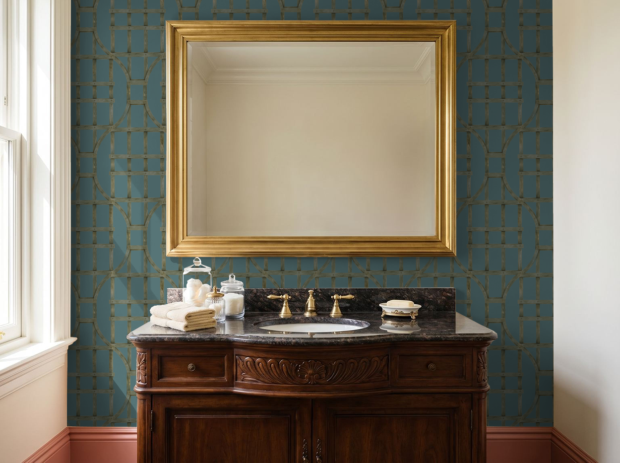 Peacock blue trellis wallpaper in elegant bathroom with gold mirror.