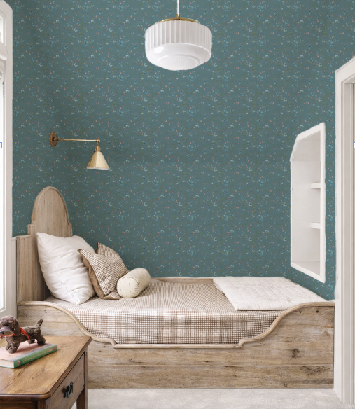 Children's bedroom with wooden bed, teal wallpaper, and white ceiling light.