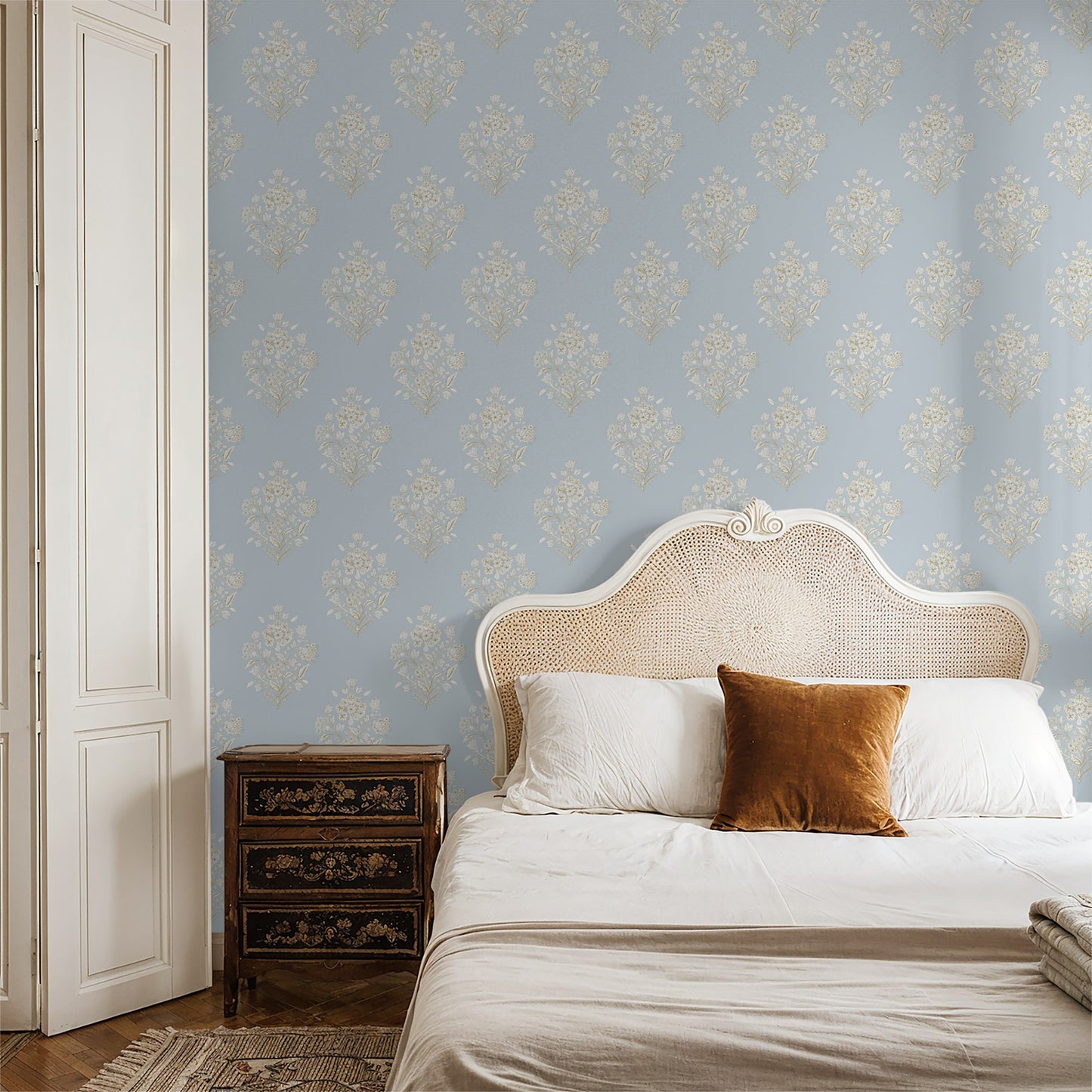Sky blue damask floral wallpaper in elegant bedroom setting with vintage decor.