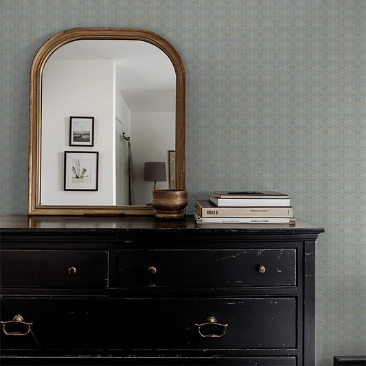 Sky blue lattice wallpaper in vintage room with mirror and dresser