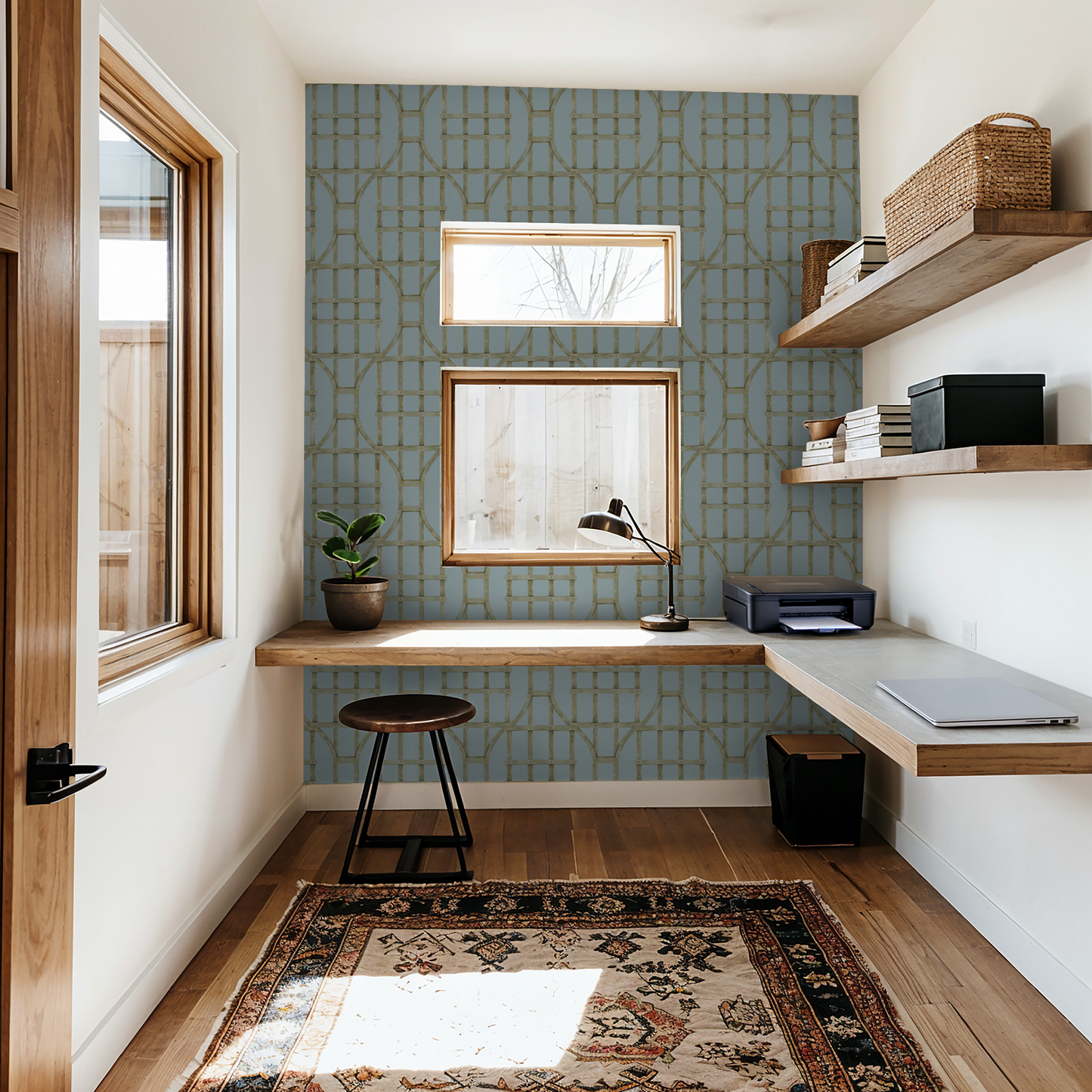 Soft blue trellis wallpaper in modern home office with wood accents.