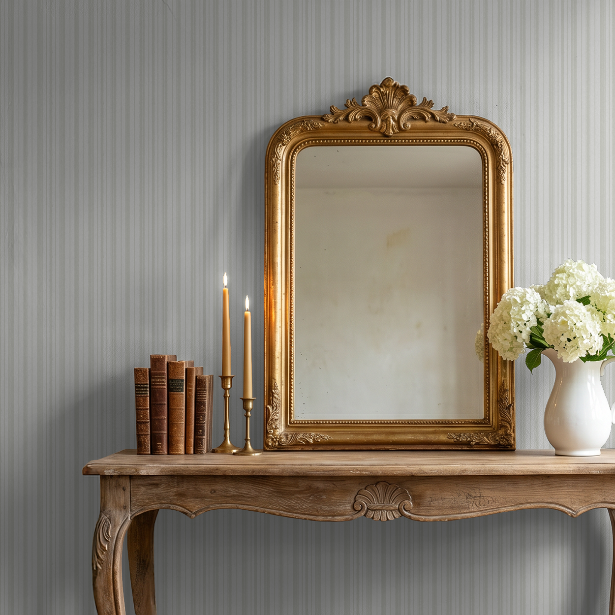 Soft green striped wallpaper in elegant room with vintage mirror and wooden table.