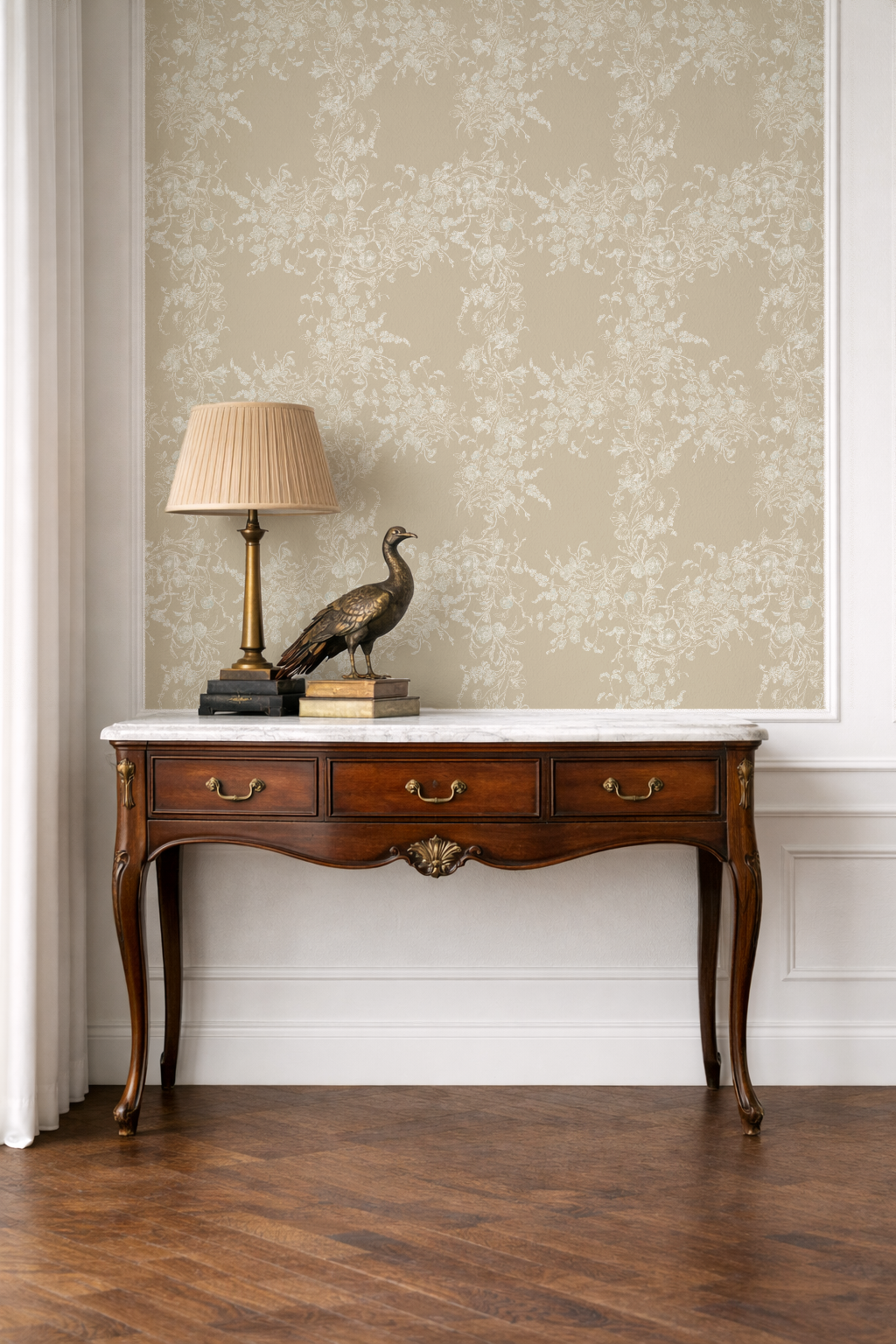Wooden console table with marble top against a floral wallpapered wall.