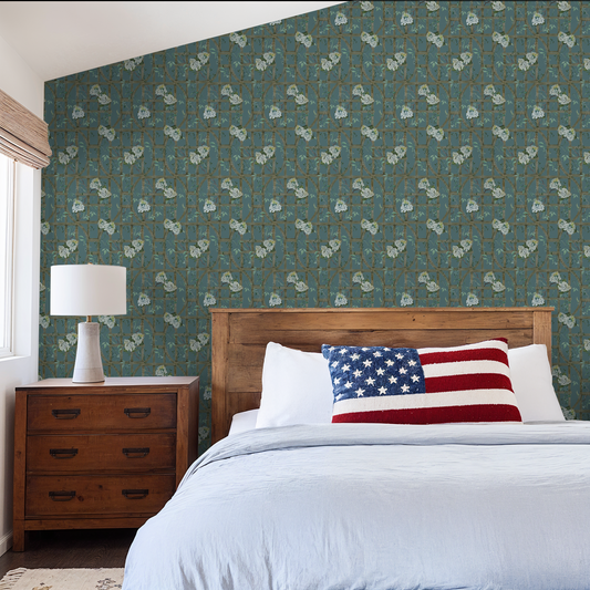 Teal floral wallpaper with hydrangea pattern in rustic bedroom setting.