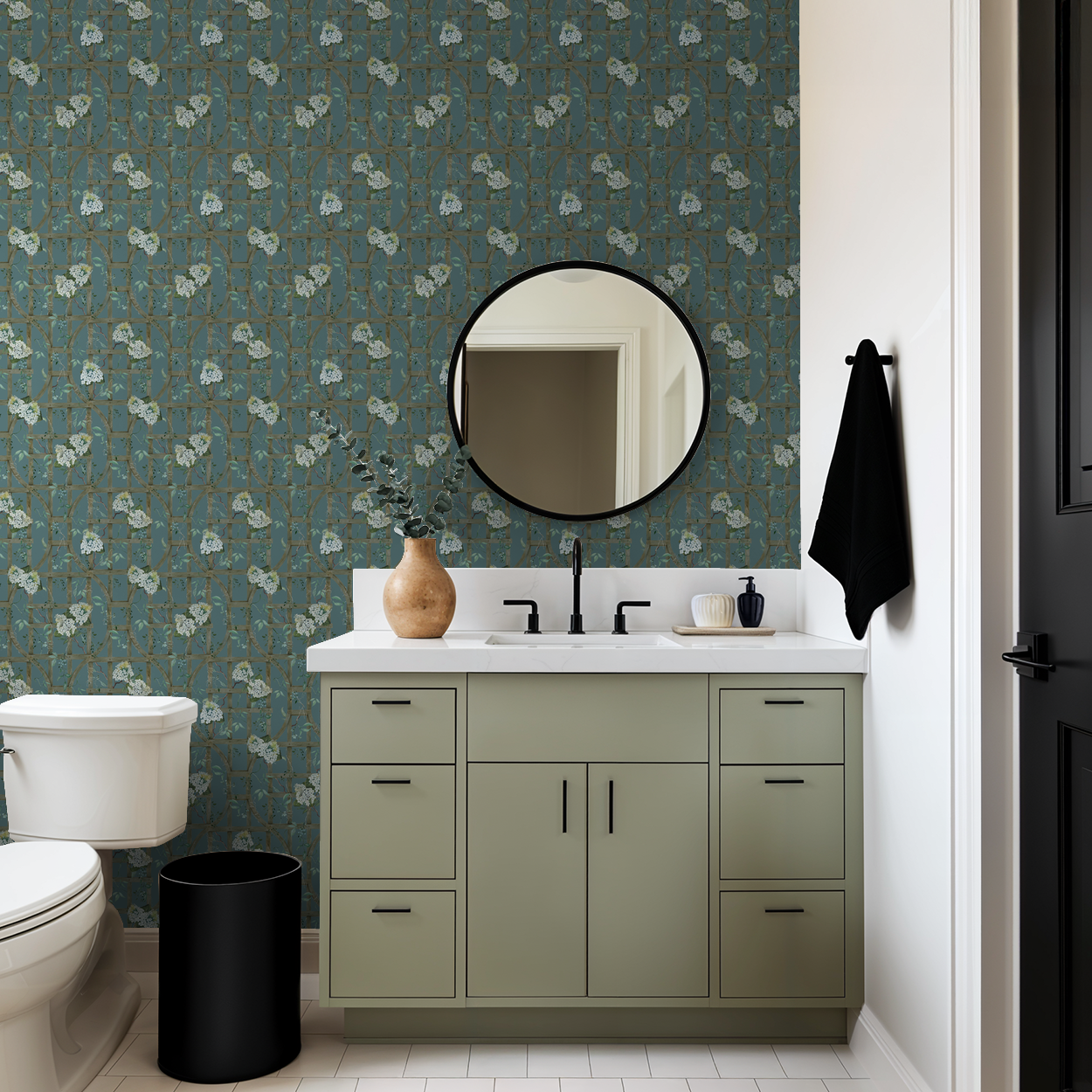 Teal hydrangea trellis wallpaper in modern bathroom with round mirror.