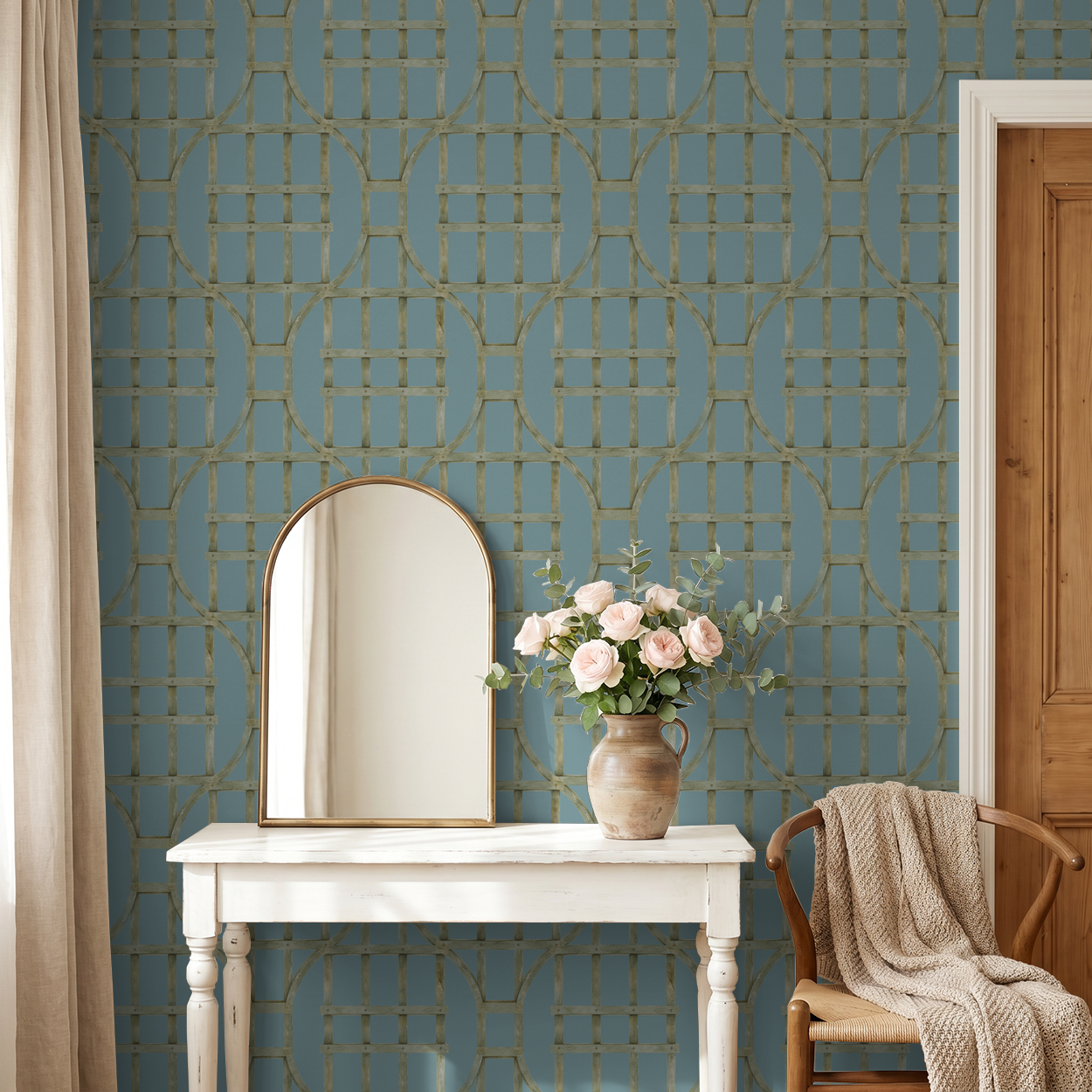 Teal trellis pattern wallpaper in elegant room with mirror and flowers.