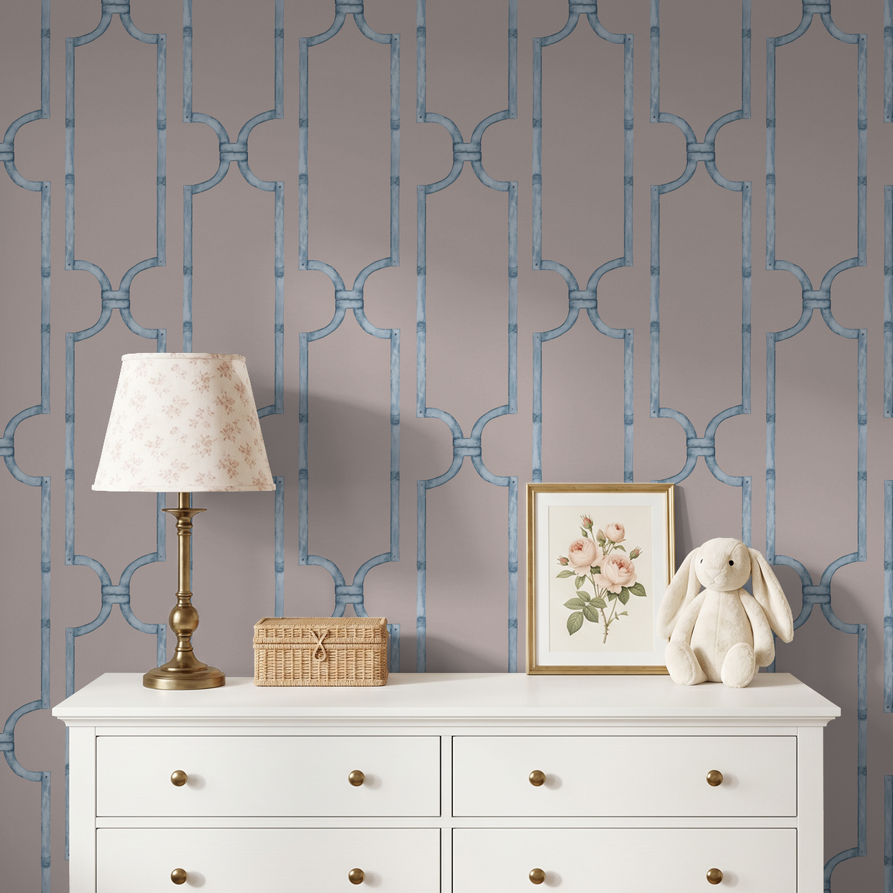Trellis blue on rose wallpaper in elegant room with white dresser and decor.