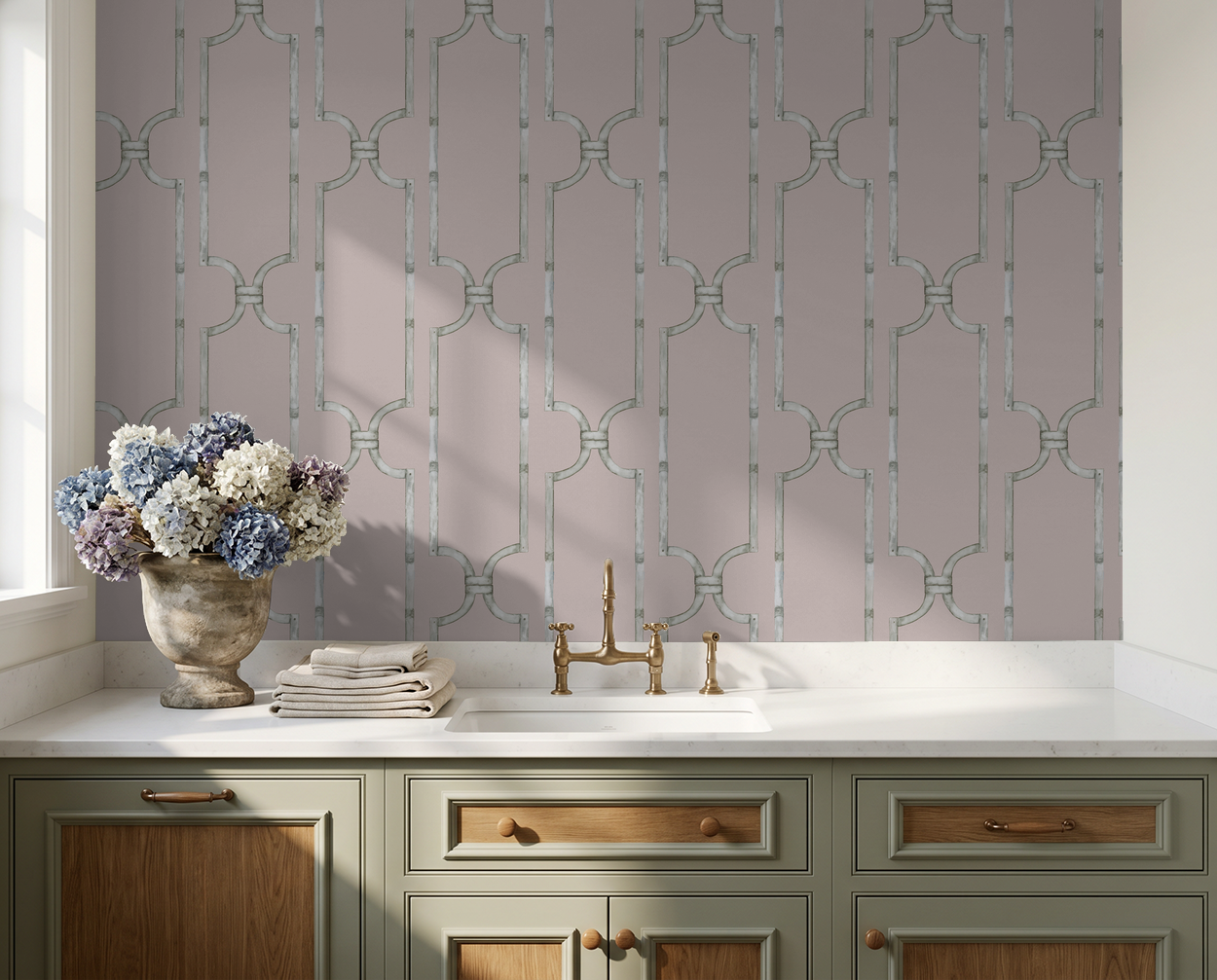 Vintage rose trellis wallpaper in kitchen with brass faucet and hydrangea vase