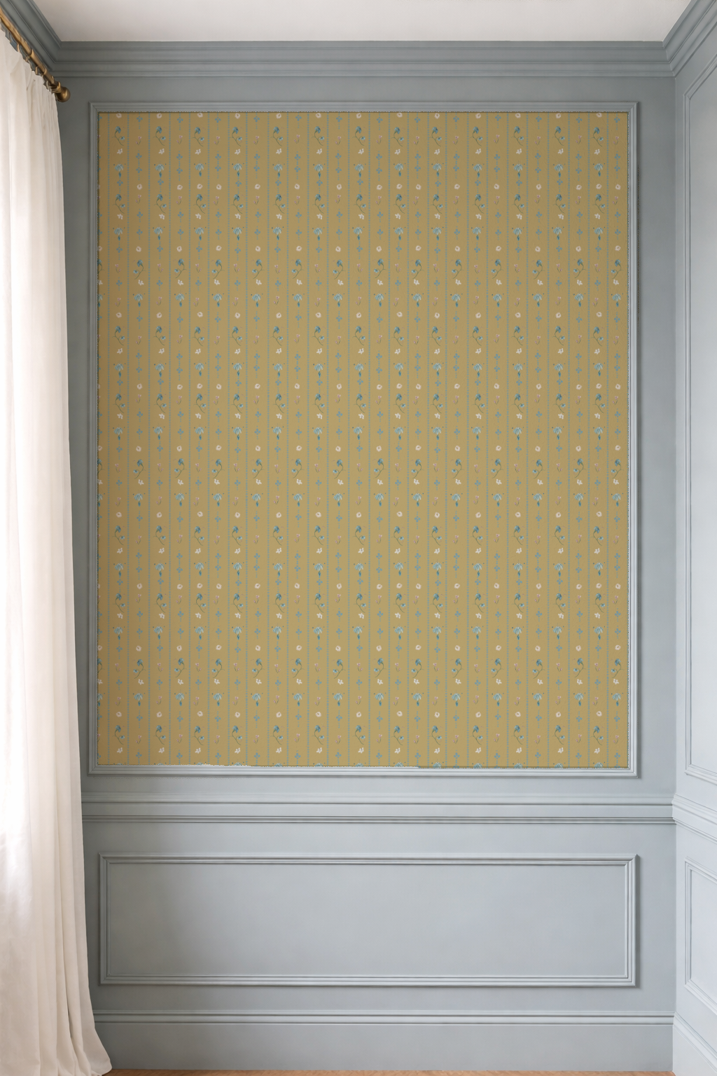 Wall with decorative yellow patterned wallpaper and gray moldings.