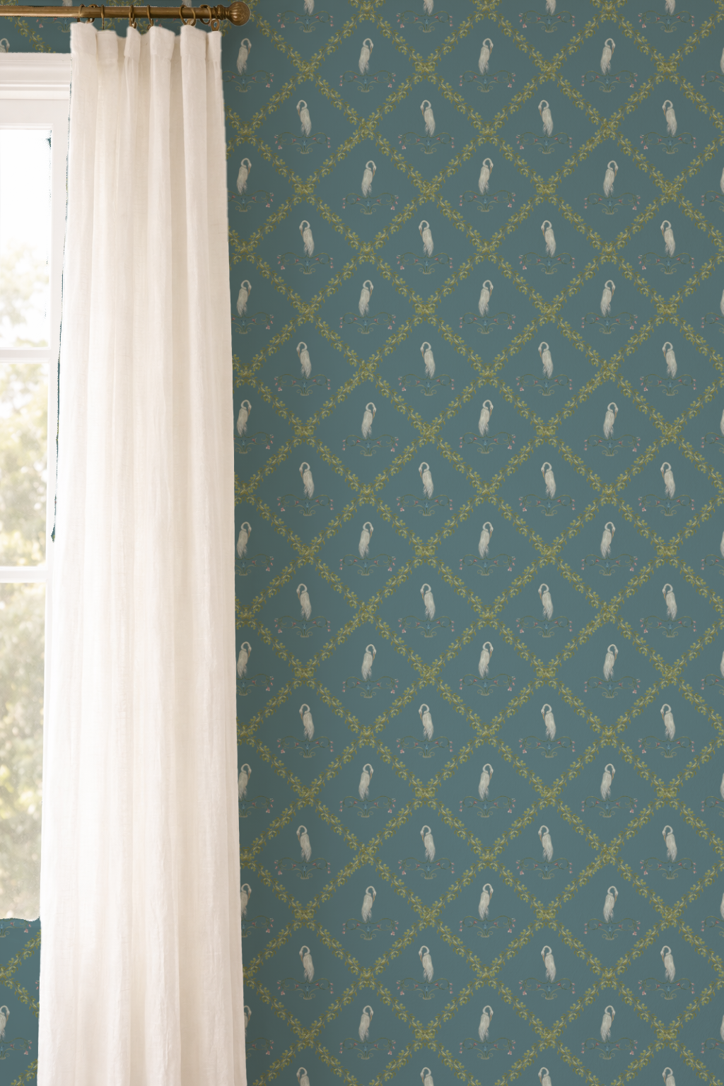 Teal wallpaper with white feather pattern next to a white curtain