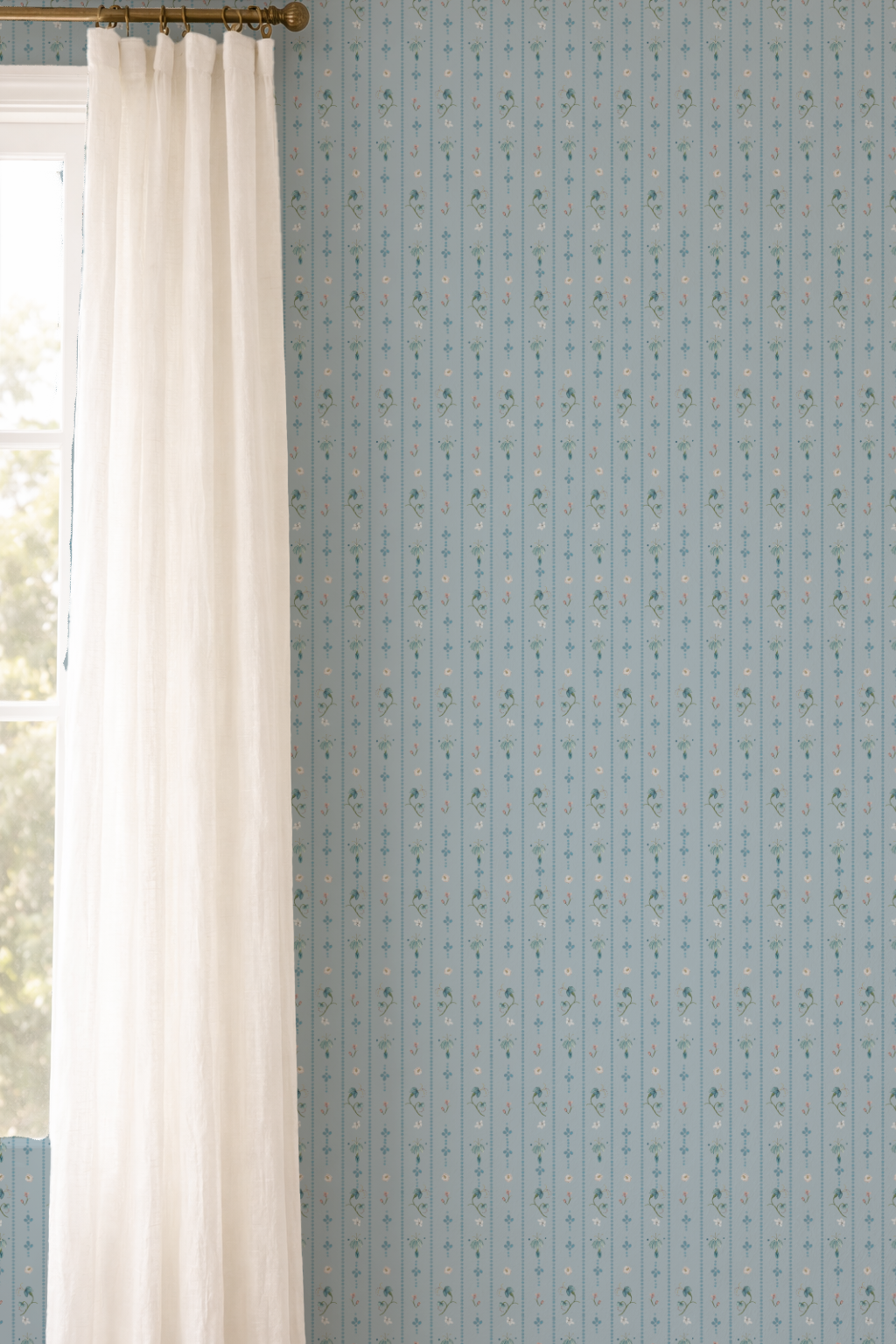Light blue patterned wallpaper with white curtains on a window