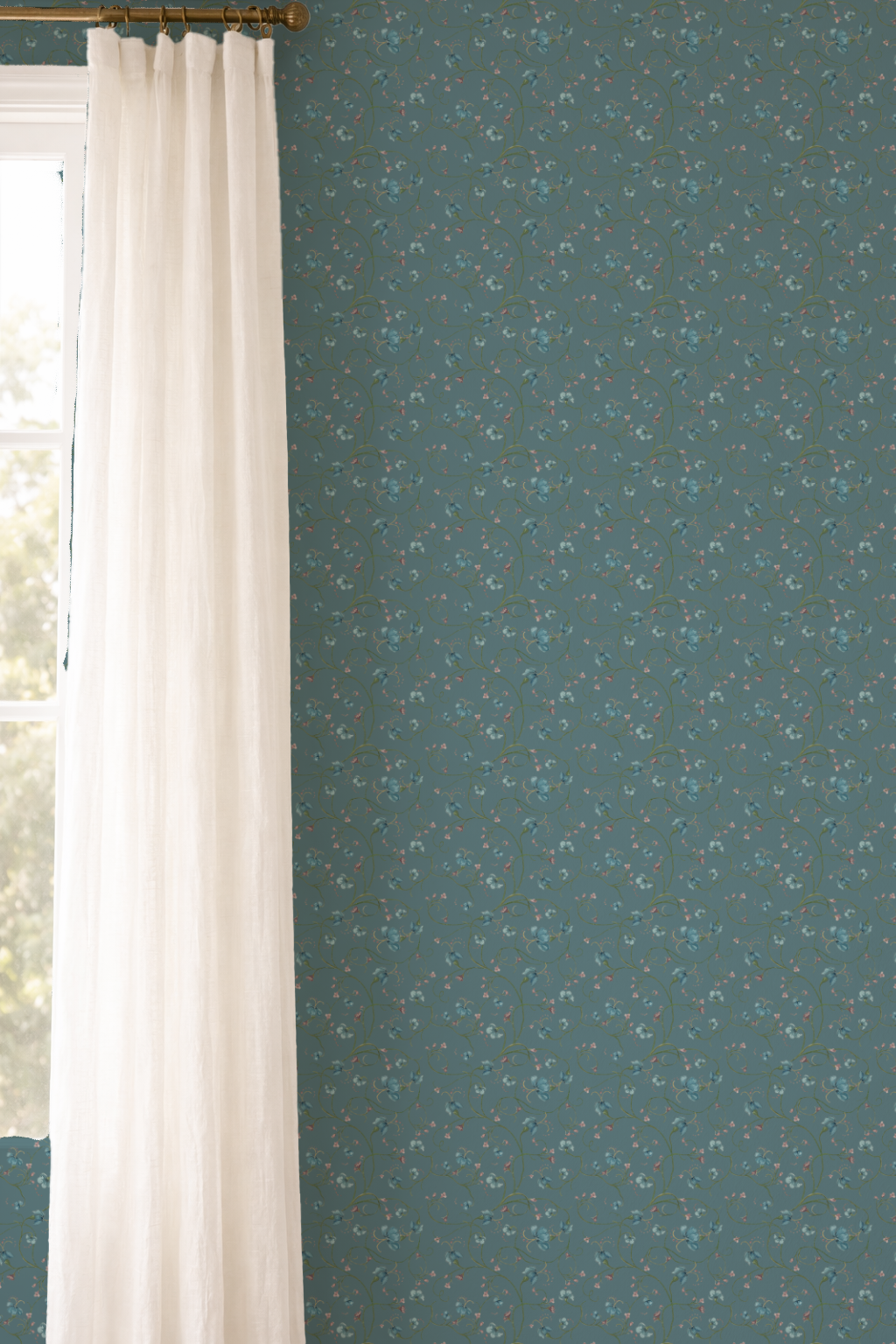 Teal wallpaper with white feather pattern next to a white curtain