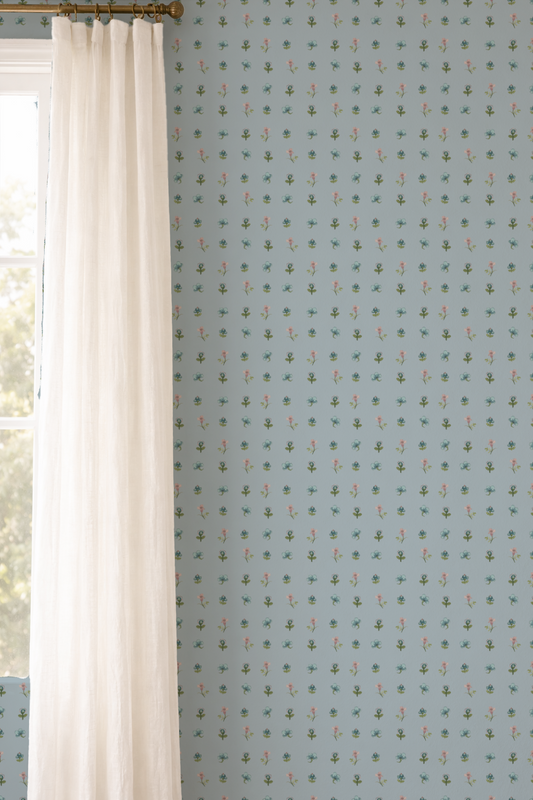 Light blue wallpaper with small pattern next to a white curtain