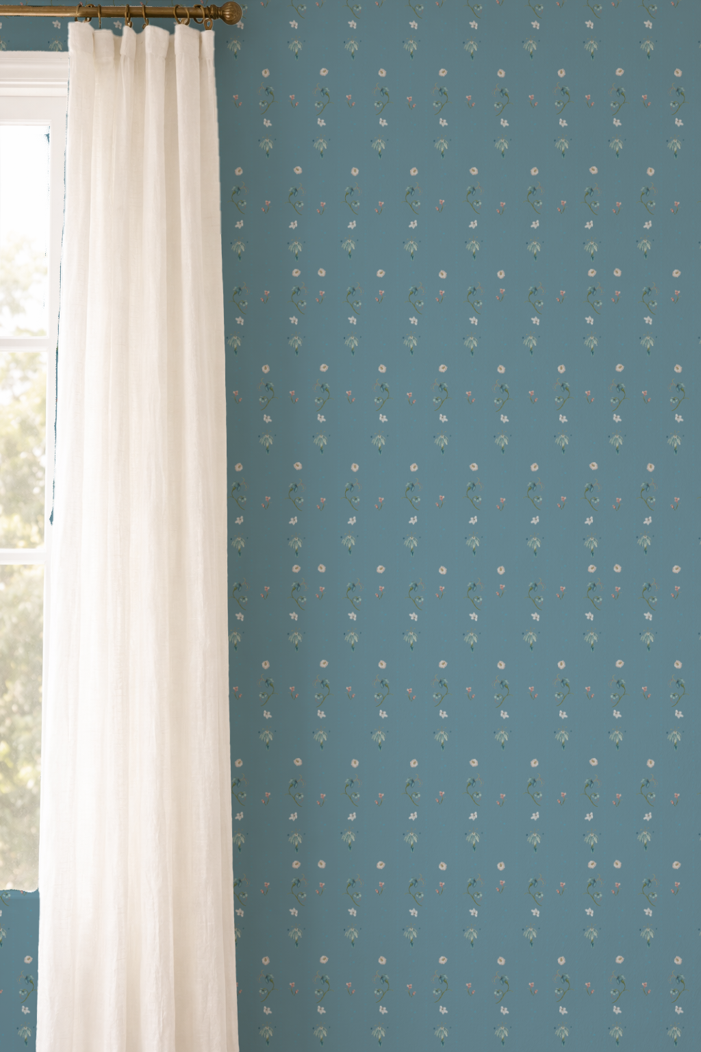 Blue wall with white polka dot pattern next to a white curtain