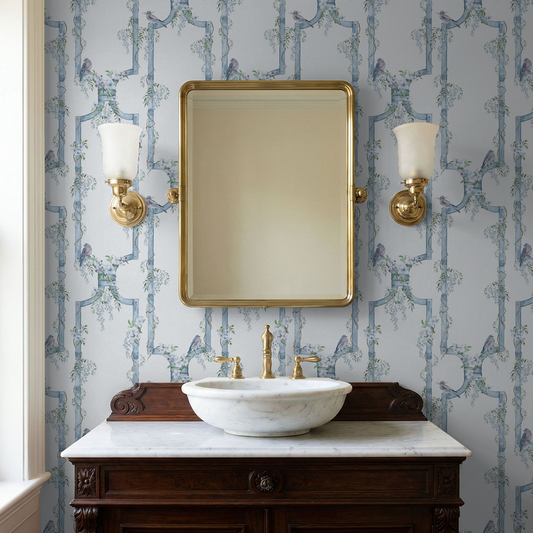 Elegant bathroom with Wisteria Gate Blue Bird Trellis wallpaper and vintage decor.