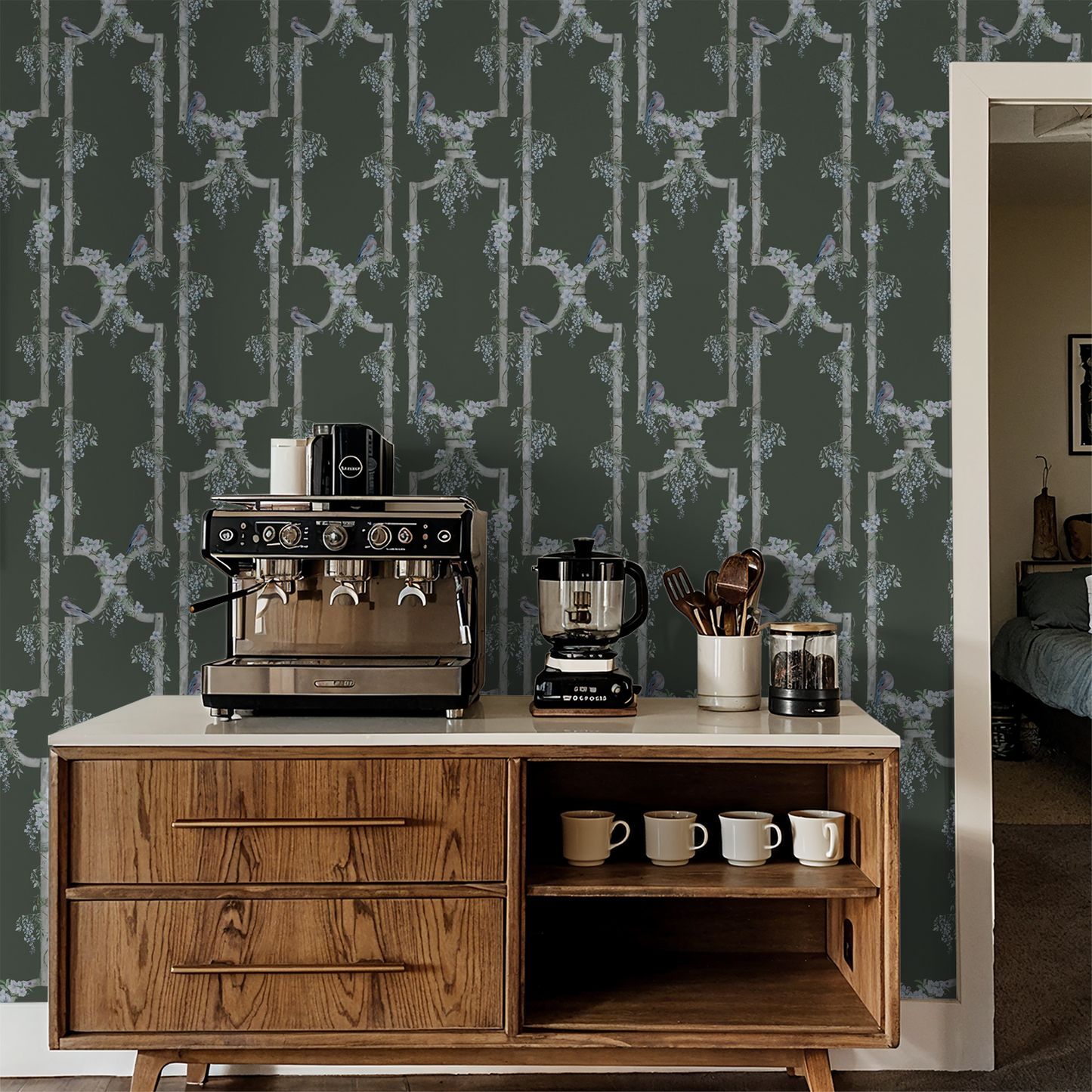 Wisteria trellis wallpaper with birds on deep green backdrop in kitchen